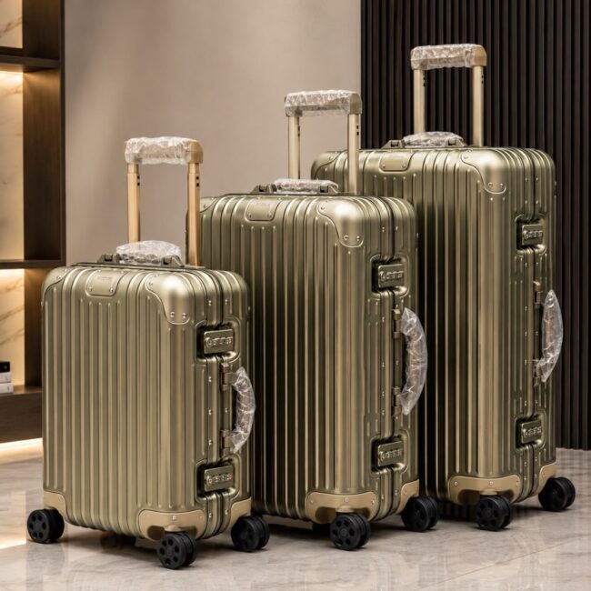Gold-toned RIMOWA Aluminum Hardshell Rolling Suitcases